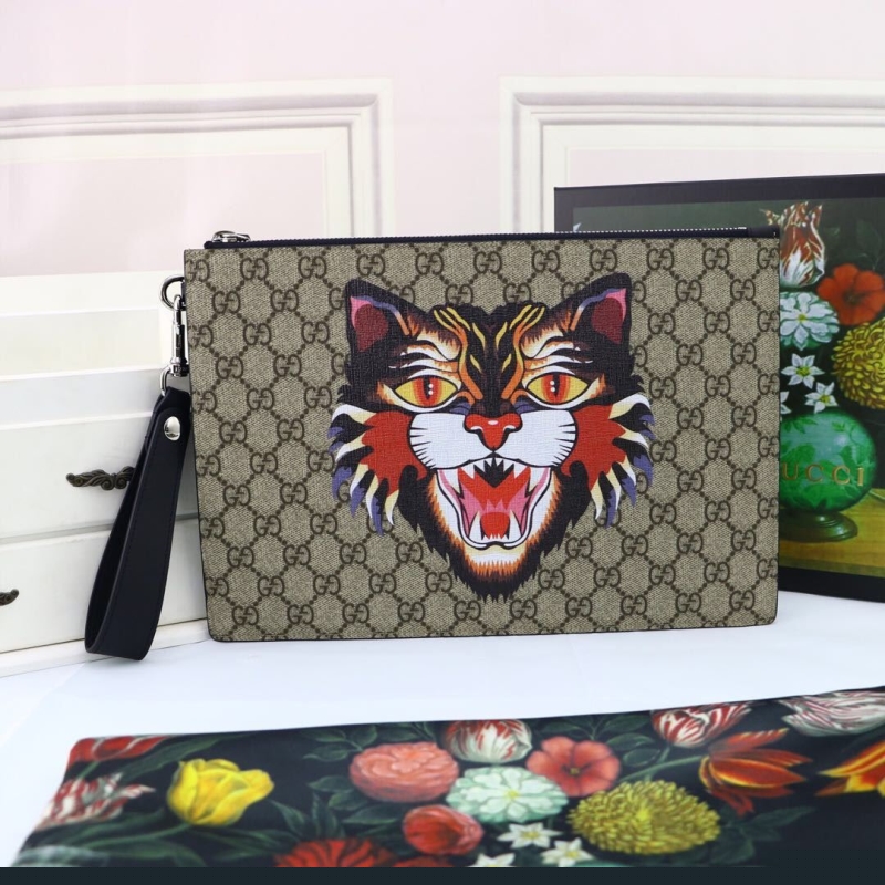 G*u*i clutch bags